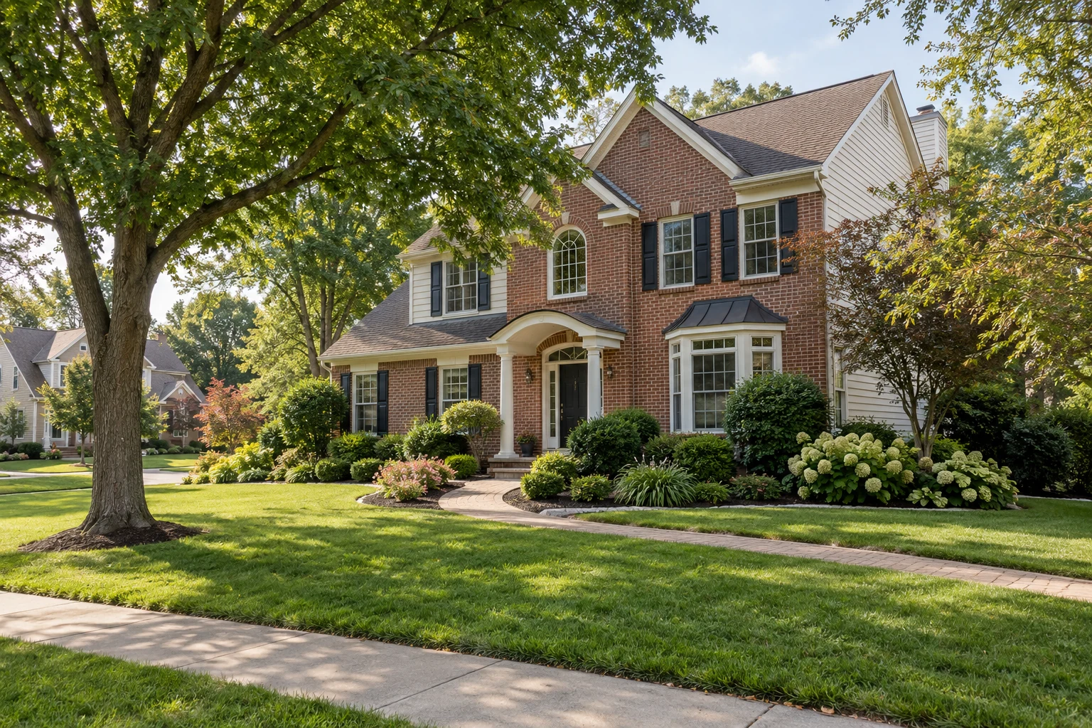 Illustrative brick and siding family home with mature trees and a garden.